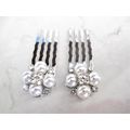 Set of two small pearl and silver hair comb bar...