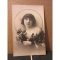 A PRETTY YOUNG GIRL WITH ROSES . unused antique...