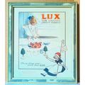 A FRAMED PRINT OF A ' LUX ' ADVERT under glass ...