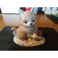Cat figurine with fish