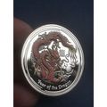 Year of the Dragon Silver coin comes in a prote...