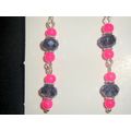Noticable bright pink & faceted clear purple cr...