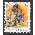 ZAMBIA 1982 VILLAGE LIFE MILLET GRINDING ON A S...