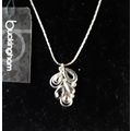 New. Silver coloured pendant with rhinestones.