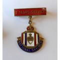 National Savings 7 Years Service enamel badge