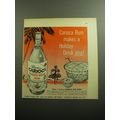 1958 Ron Carioca Rum Ad - Carioca Rum makes a holiday drink sing