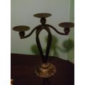 Cast iron decorative candle holder holds 3
