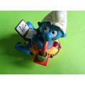 Workaholic smurf with laptop rubber ring and drink