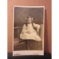young girl with ringlets .unused antique postca...