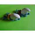 Two swimmers swimming smurfs red and yellow rub...