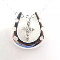 Cross in a Horse Shoe Pendant on a Silver Plate...