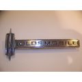 OLDSMOBILE EMBLEM OEM #7791577