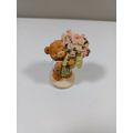 2 1/2 inch resin bear holding bunch of roses