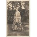 A Lady Wearing A Long Floral Dress & Shawl & Ho...