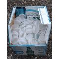 Plastic milk bottle tops, mostly white, lids ca...