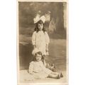 Two Little Girls with Large Bows in their Hair ...