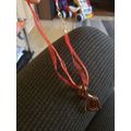 Twisted Brown Silver And Gold Pendant On Pink r...
