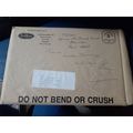 postally used envelope england has rip to front...